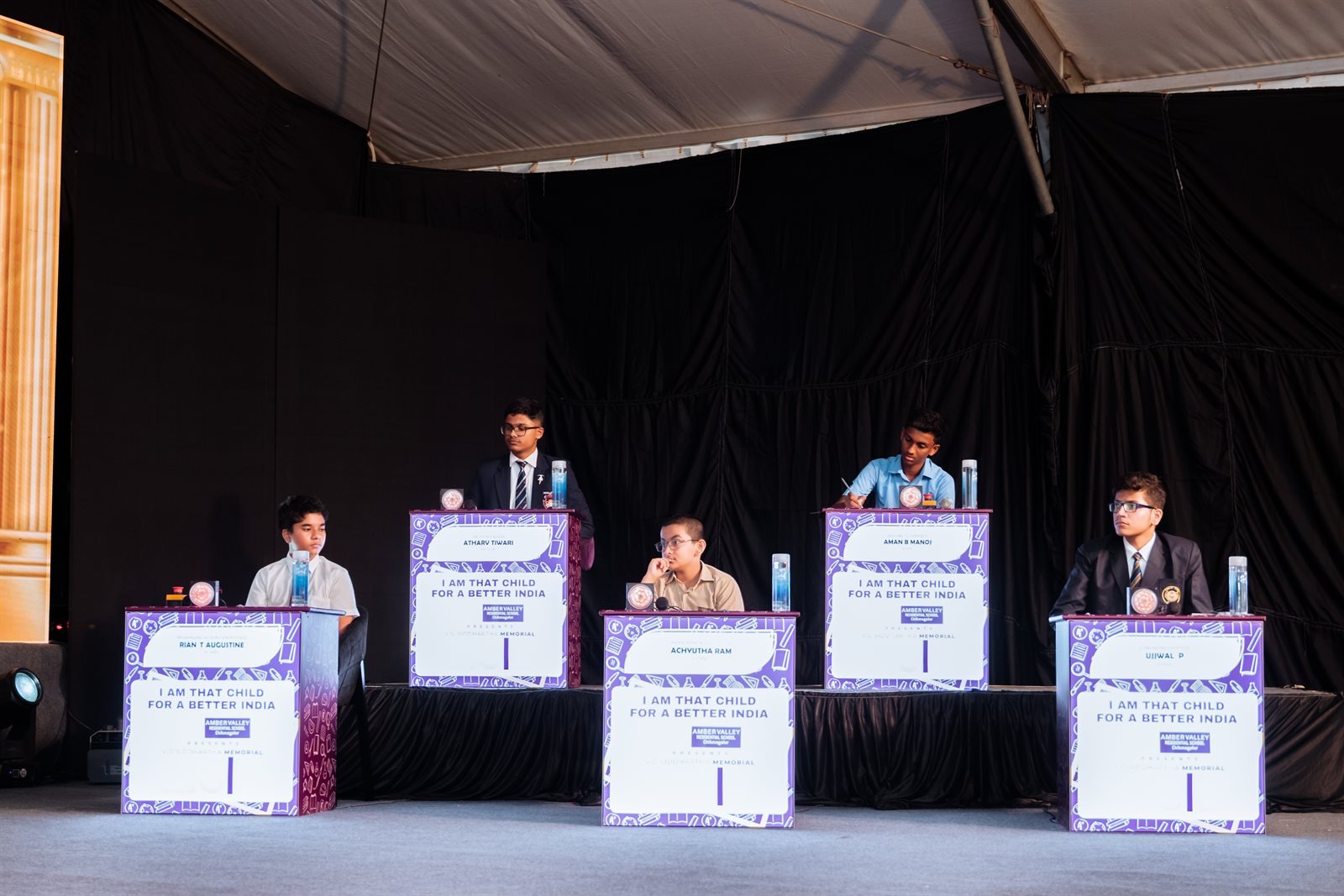 Student finalists at branded podiums in buzzer round during Season 2